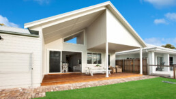 back facade of home with large outdoor entertaining area