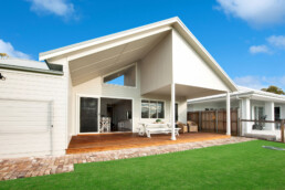 back facade of home with large outdoor entertaining area