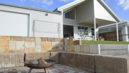 fire pit in back yard of with sandstone blocks