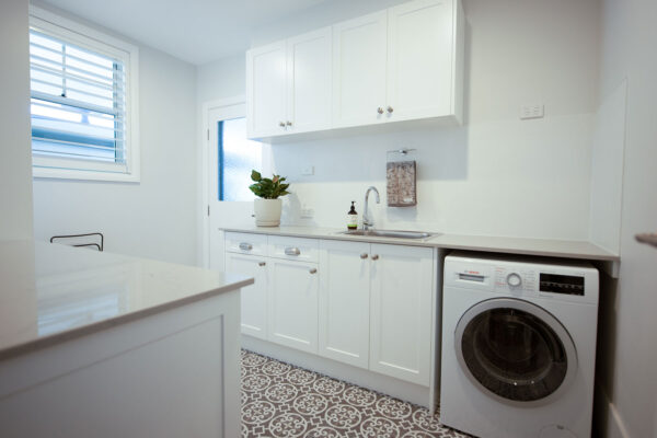 spacious laundry with moroccan style grey floor tiles