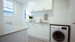 spacious laundry with moroccan style grey floor tiles