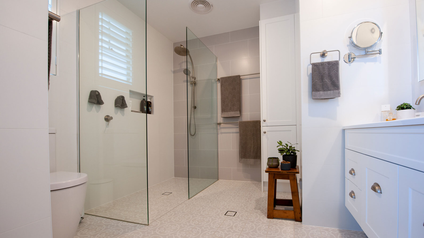 spacious bathroom with light grey floor tiles