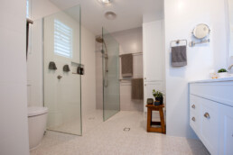 spacious bathroom with light grey floor tiles