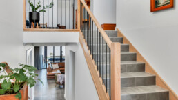 stairs showing split levels, look down to loung room and look up to landing space