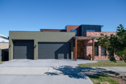 New home build, rustic industrial facade with large 3 car garage