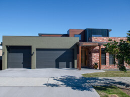 New home build, rustic industrial facade with large 3 car garage