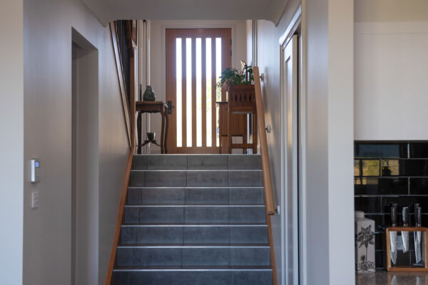 internal tiled stairs leading to entry of home