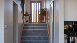 internal tiled stairs leading to entry of home